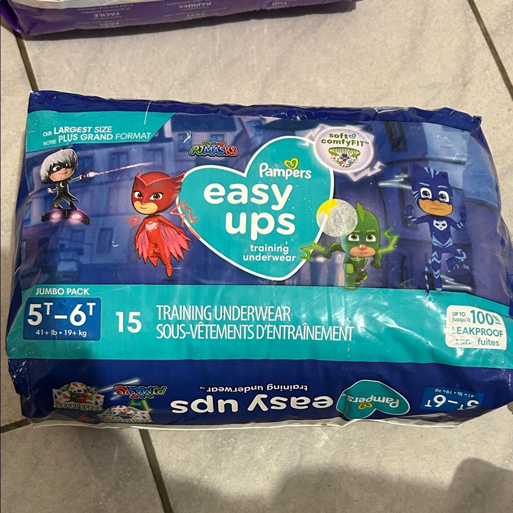 Pampers easy up brand new, taped on side but brand new